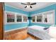 Bright bedroom with hardwood floors, multiple windows, and a modern ceiling fan at 966 Blue Ridge Ne Ave, Atlanta, GA 30306
