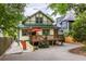 Rear exterior with a raised wood deck with red accents and a stone driveway at 966 Blue Ridge Ne Ave, Atlanta, GA 30306