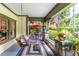 Inviting covered porch with swing, outdoor seating, and lush greenery, offering a perfect spot for relaxation at 966 Blue Ridge Ne Ave, Atlanta, GA 30306