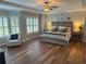 Spacious main bedroom with large windows, tray ceilings, and hardwood floors at 970 Tarpley Nw Rd, Kennesaw, GA 30152