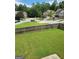 Spacious green backyard with a wooden fence and street view at 2424 Saint Andrews Rdg, College Park, GA 30337