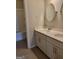 Bright bathroom with double sinks, white cabinets, modern fixtures, and neutral tones at 2424 Saint Andrews Rdg, College Park, GA 30337