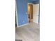 Bedroom with blue walls, carpet flooring and view of adjacent bathroom at 2424 Saint Andrews Rdg, College Park, GA 30337