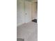 Bedroom hallway space, features plush neutral carpeting and multiple white paneled doors for closets and storage at 2424 Saint Andrews Rdg, College Park, GA 30337