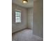 Walk-in closet with adjustable shelving, offering lots of storage space, plus a window for natural light at 2424 Saint Andrews Rdg, College Park, GA 30337