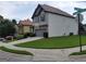 Charming two-story home featuring stone accents, gray siding and a well-manicured lawn at 2424 Saint Andrews Rdg, College Park, GA 30337