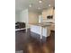 Spacious kitchen with granite countertops, white cabinetry, stainless appliances and large island at 2424 Saint Andrews Rdg, College Park, GA 30337