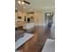Open-concept living space with hardwood floors connecting the kitchen, living, and dining areas, great for entertaining at 2424 Saint Andrews Rdg, College Park, GA 30337