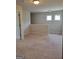 Neutral and spacious loft area with natural lighting, ideal for creating a flexible space for relaxation or hobbies at 2424 Saint Andrews Rdg, College Park, GA 30337