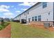 Well-maintained townhome backyards featuring green grass, patios, and wood-look privacy fences at 3560 Bexton Dr, Duluth, GA 30097