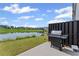 Private backyard with a patio and a grill, with a calming view of a lake at 3560 Bexton Dr, Duluth, GA 30097