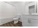 Clean bathroom featuring a white sink vanity with modern fixtures at 3560 Bexton Dr, Duluth, GA 30097