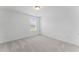 Clean bedroom featuring a window and neutral carpet and wall colors at 3560 Bexton Dr, Duluth, GA 30097