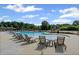Relaxing lounge chairs poolside at the community pool on a sunny day at 3560 Bexton Dr, Duluth, GA 30097
