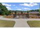Welcoming dog park with lush green space, surrounded by trees and walking paths at 3560 Bexton Dr, Duluth, GA 30097