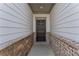 Close-up of an elegant front door with brick accents at 3560 Bexton Dr, Duluth, GA 30097