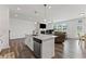 Stylish kitchen island with seating and modern lighting at 3560 Bexton Dr, Duluth, GA 30097
