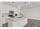 Modern kitchen with white cabinets, stainless steel appliances, and a granite island at 3560 Bexton Dr, Duluth, GA 30097