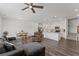 Open concept living and dining area with a ceiling fan and modern flooring at 3560 Bexton Dr, Duluth, GA 30097