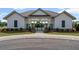 Pool entrance building with manicured lawn and flower beds adds to the community's appeal at 3560 Bexton Dr, Duluth, GA 30097