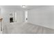 Open landing area with carpeting and access to the laundry room at 3560 Bexton Dr, Duluth, GA 30097