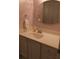 Bright bathroom featuring a white vanity, oval mirror, and soft decor at 1932 Variations Ne Dr, Atlanta, GA 30329