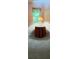Cozy bedroom nook with window and a small round table with table lamp at 1932 Variations Ne Dr, Atlanta, GA 30329