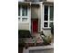 Exterior facade featuring a vibrant red door and large windows bringing in natural light at 1932 Variations Ne Dr, Atlanta, GA 30329