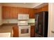 Kitchen featuring wooden cabinets, stainless steel appliances, and great lighting at 1932 Variations Ne Dr, Atlanta, GA 30329
