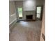 Bright living room featuring a fireplace and access to an outdoor area at 1932 Variations Ne Dr, Atlanta, GA 30329