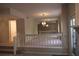 Open living room with chandelier lighting and staircase at 1932 Variations Ne Dr, Atlanta, GA 30329