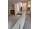 Open living room with a bar, staircase, and neutral-toned carpeting at 1932 Variations Ne Dr, Atlanta, GA 30329