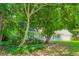 Quaint single-Gathering home featuring a manicured lawn and traditional architectural details at 230 Belmont Trl, Covington, GA 30016