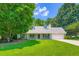 Beautiful single-story home with a well-maintained lawn and traditional architectural details at 230 Belmont Trl, Covington, GA 30016