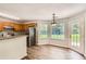 Bright kitchen area with stainless steel refrigerator, granite counters, and access to outdoor patio at 230 Belmont Trl, Covington, GA 30016