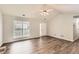 Bright living room with a large window, modern flooring, and an open layout for flexible living at 230 Belmont Trl, Covington, GA 30016