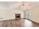 Inviting living room showcasing modern flooring and a beautiful stone fireplace focal point at 230 Belmont Trl, Covington, GA 30016