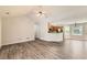 Spacious living room featuring modern flooring and a seamless flow into the kitchen area at 230 Belmont Trl, Covington, GA 30016