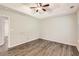 Spacious main bedroom with wood-look floors and neutral walls, providing a serene atmosphere at 230 Belmont Trl, Covington, GA 30016