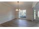 Elegant dining area with hardwood floors and a large window providing ample natural light at 2346 Hampton Park Dr, Buford, GA 30519