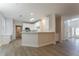 Modern kitchen with an island, white cabinetry, and a view of the entryway at 2346 Hampton Park Dr, Buford, GA 30519