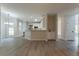 Bright living room with hardwood floors, dining area, and a kitchen view at 2346 Hampton Park Dr, Buford, GA 30519