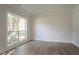 Bright living room boasting hardwood floors and a large window for natural light at 2346 Hampton Park Dr, Buford, GA 30519