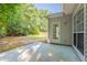 View of the backyard from the patio with an exit door at 2346 Hampton Park Dr, Buford, GA 30519