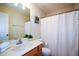 Bathroom featuring a clean single sink vanity and a shower with white curtain at 3332 Chastain Landings Ct, Marietta, GA 30066