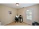 Neutral bedroom with a work space featuring a desk, black chair, and beige carpet at 3332 Chastain Landings Ct, Marietta, GA 30066