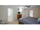 Bedroom with neutral decor featuring a ceiling fan and a view into the Primary bath at 3332 Chastain Landings Ct, Marietta, GA 30066