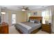 A spacious bedroom with a ceiling fan and an entrance to the balcony at 3332 Chastain Landings Ct, Marietta, GA 30066