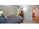 Comfortable bedroom with ceiling fan, natural light, and neutral color scheme at 3332 Chastain Landings Ct, Marietta, GA 30066