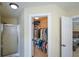 Walk-in closet with ample storage space and built-in organization, next to shower at 3332 Chastain Landings Ct, Marietta, GA 30066